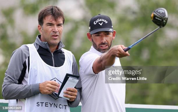 Pablo Larrazabal of Spain talks with his caddie on the 15th tee during day one of the Steyn City Championship at The Club at Steyn City on March 17,...