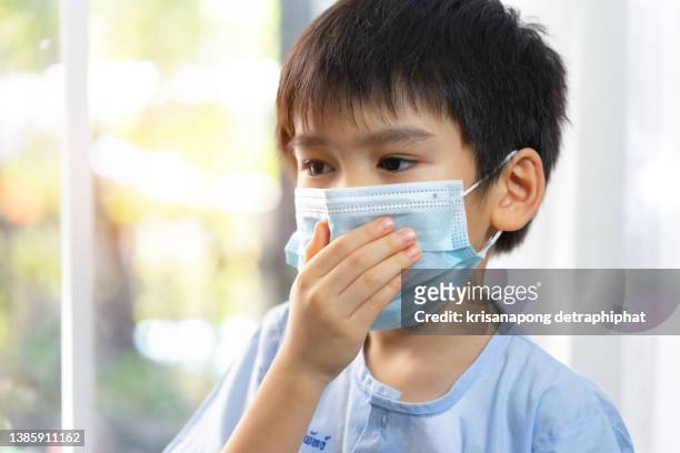 cute little boy coughing,lockdown and home isolation concept - epidemiology icon stock pictures, royalty-free photos & images