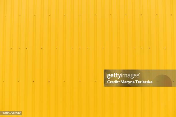 yellow metallic background for pattern design. universal background. banner. background backdrop. - corrugated metal stockfoto's en -beelden