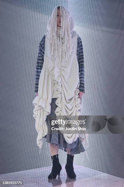 In this image released on March 18, a model showcases designs by PAINTERS in a prerecorded runway show as a part of Seoul Fashion Week 2022 AW on...