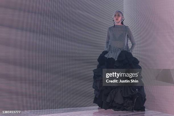 In this image released on March 18, a model showcases designs by PAINTERS in a prerecorded runway show as a part of Seoul Fashion Week 2022 AW on...