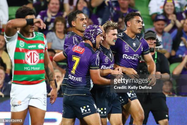 Ryan Papenhuyzen of the Storm celebrates a try with team mates during the round two NRL match between the Melbourne Storm and the South Sydney...