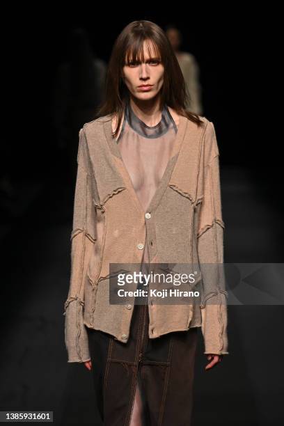 Model showcases designs by MALION vintage on runway as part of Rakuten Fashion Week TOKYO 2022 A/W at Shibuya Hikarie Hall on March 17, 2022 in...