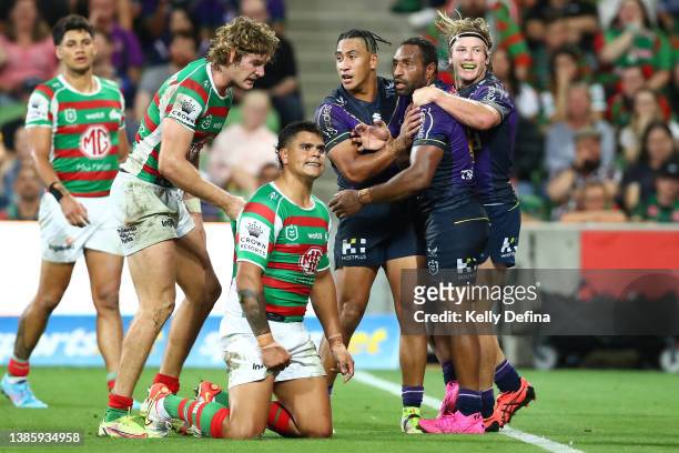 Justin Olam of the Storm celebrates a try during the round two NRL match between the Melbourne Storm and the South Sydney Rabbitohs at AAMI Park, on...