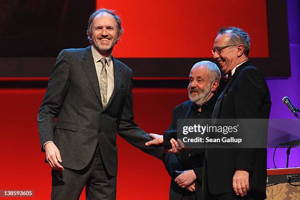 Jury members Anton Corbijn, Mike Leigh and festival director Dieter Kosslick attend the Opening Ceremony of the 62nd Berlin International Film...