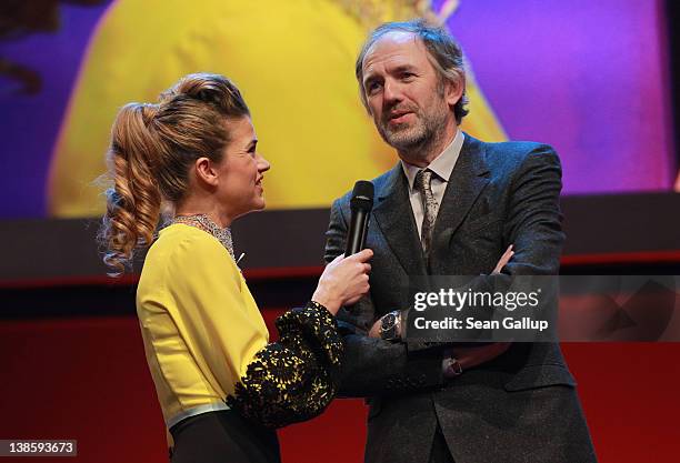 Jury member Anton Corbijn and presenter Anke Engelke attend the Opening Ceremony of the 62nd Berlin International Film Festival at the Berlinale...