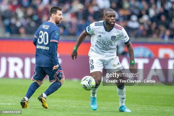 August 10: Jean Onana of Bordeaux watched by Lionel Messi of Paris Saint-Germain during the Paris Saint-Germain Vs Bordeaux, French Ligue 1 regular...