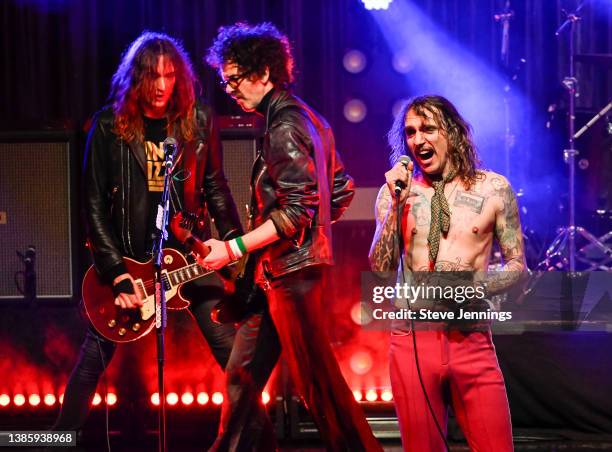 Justin Hawkins, Frankie Poullain and Dan Hawkins of The Darkness perform at The Regency Ballroom on March 16, 2022 in San Francisco, California.