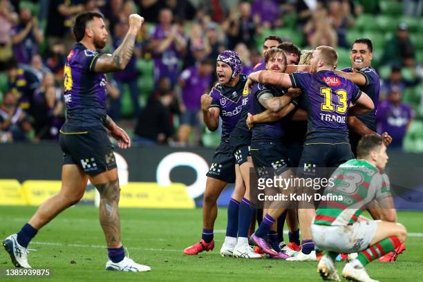 Storm celebrate winning the round two NRL match between the Melbourne Storm and the South Sydney Rabbitohs at AAMI Park, on March 17 in Melbourne,...