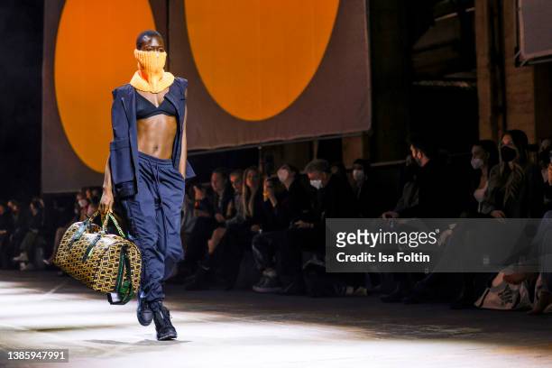 Model Aminata Sonogo walks the runway at the Eli by Elias Rumelis show at the Mercedes-Benz Fashion Week Berlin March 2022 at Kraftwerk Mitte on...