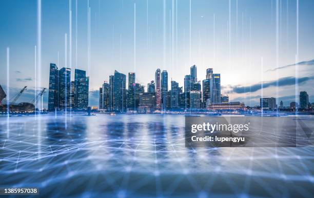 cityscape with abstract particles - singapore night stock pictures, royalty-free photos & images