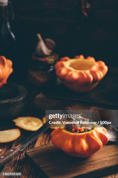 stuffed pattypan squash on cutting board - pattypan squash stock pictures, royalty-free photos & images