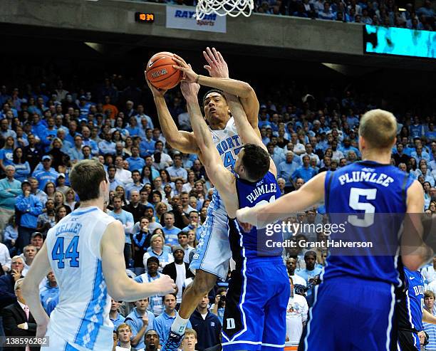 James Michael McAdoo of the North Carolina Tar Heels shoots over Miles Plumlee of the Duke Blue Devils at the Dean Smith Center on February 8, 2012...