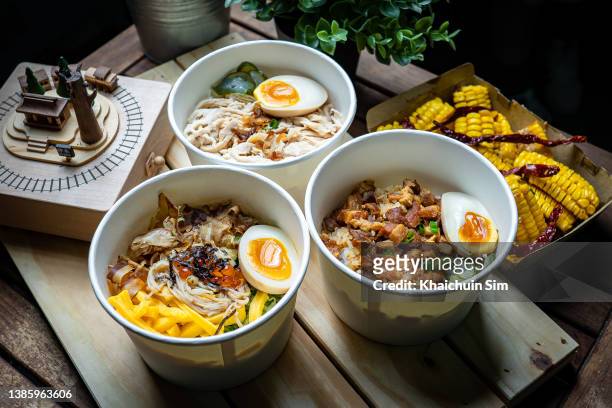 take away taiwanese food with rice in paper bowl - taiwanese stock pictures, royalty-free photos & images