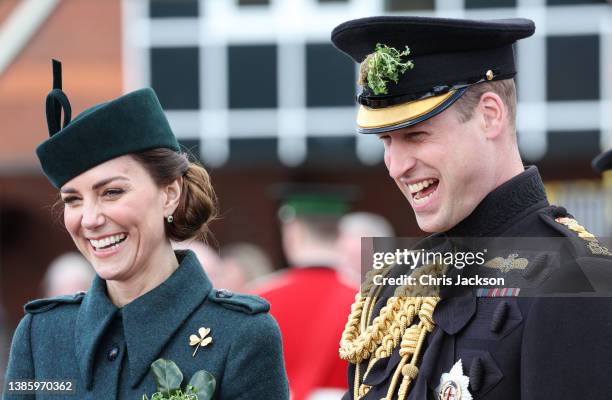 Catherine, Duchess of Cambridge and Prince William, Duke of Cambridge smile and laugh as they attend the 1st Battalion Irish Guards' St. Patrick's...