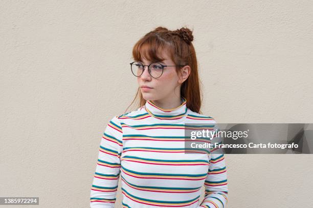 woman with freckles and glasses looking away - oranje haar stockfoto's en -beelden