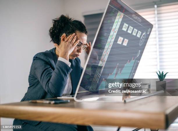 stressed businesswoman feeling desperate on crisis crypto market - excess data stock pictures, royalty-free photos & images