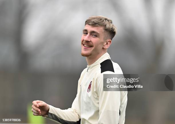 Alexis Saelemaekers of AC Milan looks on during AC Milan training session at Milanello on March 17, 2022 in Cairate, Italy.