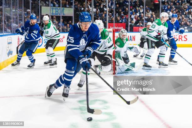 Ondrej Kase of the Toronto Maple Leafs skates against Ryan Suter of the Dallas Stars during the third period at the Scotiabank Arena on March 15,...