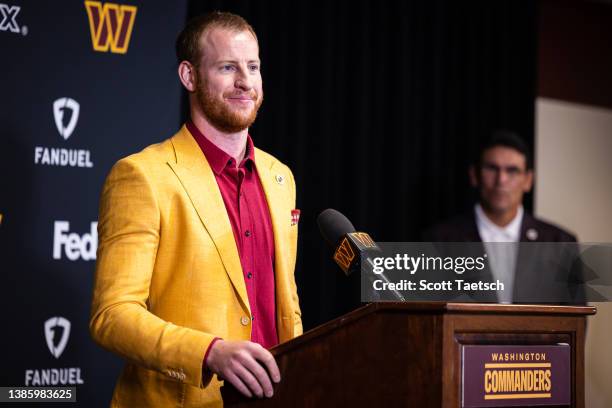 Head coach Ron Rivera looks on as quarterback Carson Wentz of the Washington Commanders is introduced at Inova Sports Performance Center on March 17,...