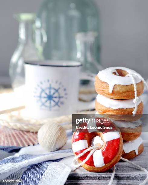 stack of donuts on light background - lifesavers candy stock pictures, royalty-free photos & images