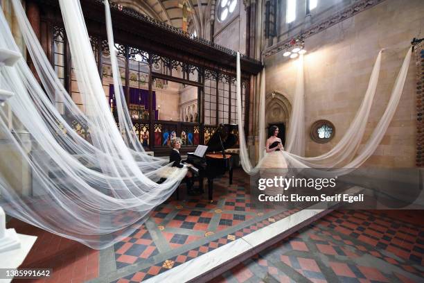 Musicians performs at the Sudi Etuz Presentation during the Fashion Week Istanbul at The Crimea Memorial Church Istanbul on March 17, 2022 in...