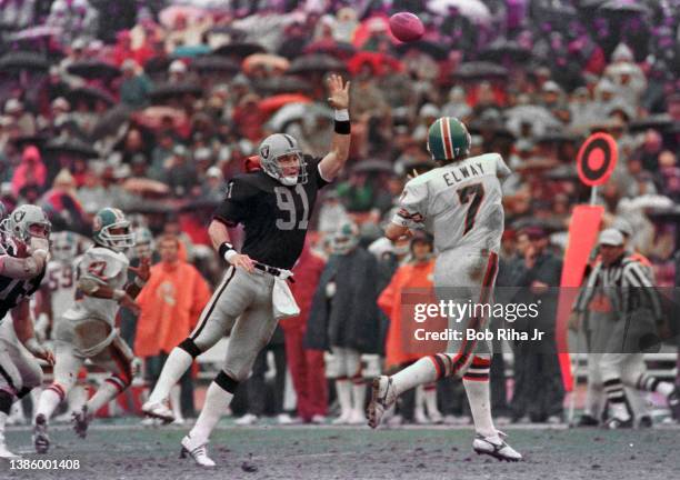 Broncos quarterback John Elway during game action of Los Angeles Raiders vs Denver Broncos, November 24, 1985 in Los Angeles, California.