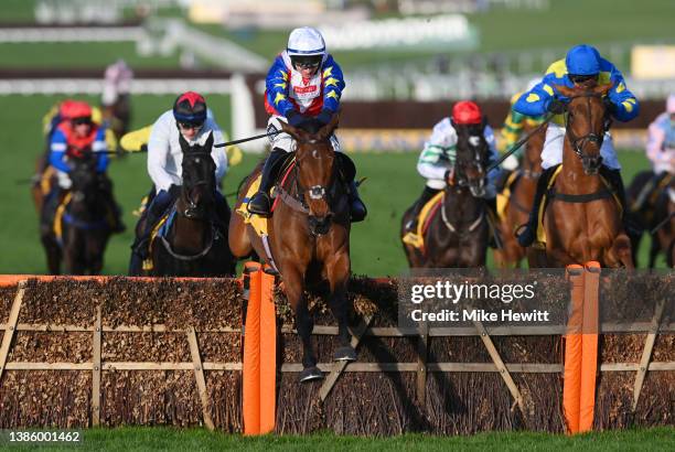 Jonathan Burke on Love Envoi clear the last to win The Dawn Run Mares’ Novices’ Hurdle race during day three of The Cheltenham Festival 2022 at...