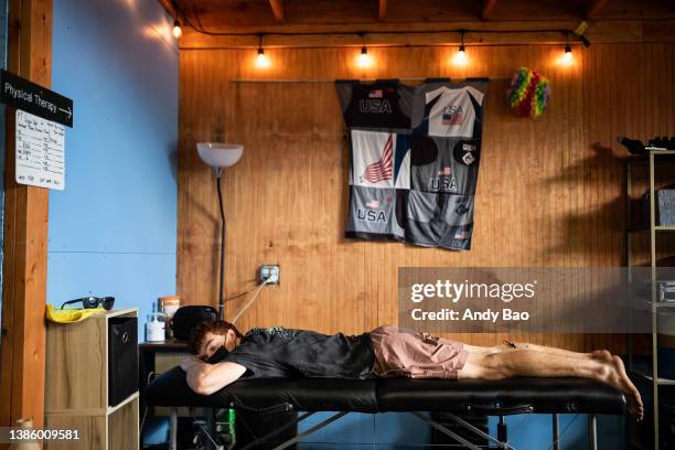 Ross Fulkerson relaxes during a dry-needling physical therapy session at the USA Climbing Training Center in Salt Lake City, Utah on May 24, 2021.