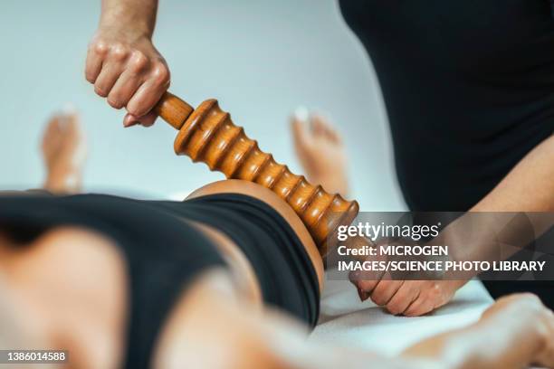 rolling pin maderotherapy massage - celulite stock pictures, royalty-free photos & images