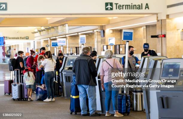 Santa Ana, CA Travelers check in at John Wayne Airport in Santa Ana, CA on Tuesday, March 15, 2022.