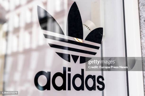 Sign on the window of an Adidas store, March 5 in Madrid, Spain. Several companies have closed their branches and stores in Russia after it invaded...