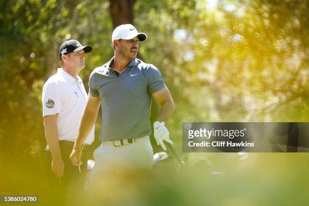 Jason Kokrak of the United States and Brooks Koepka of the United States look on from the ninth tee during the first round of the Valspar...