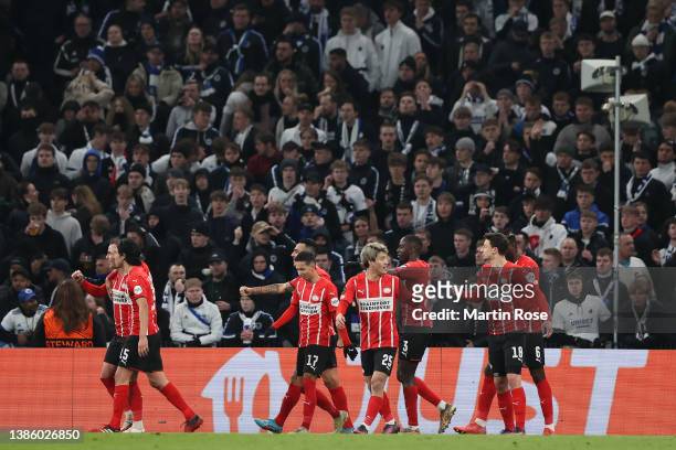 Mario Goetze of PSV Eindhoven celebrates with teammates after scoring their team's second during the UEFA Conference League Round of 16 Leg Two match...