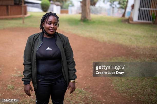 Nakyiza Joweria, aged 25 from Lukaya, poses for a portrait on March 16, 2022 in Masaka, Uganda. Nakyiza has been in the program for 4 months, and...
