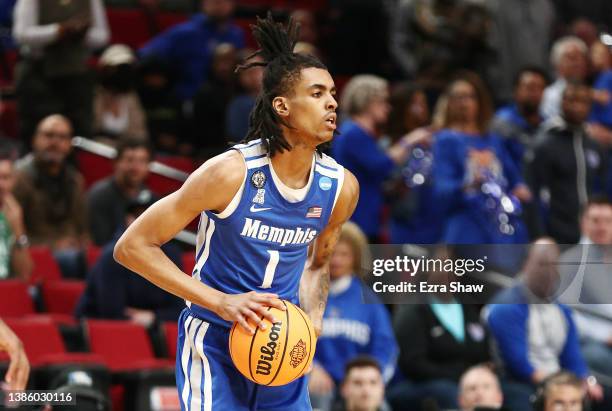 Emoni Bates of the Memphis Tigers handles the ball during the first half against the Boise State Broncos in the first round game of the 2022 NCAA...