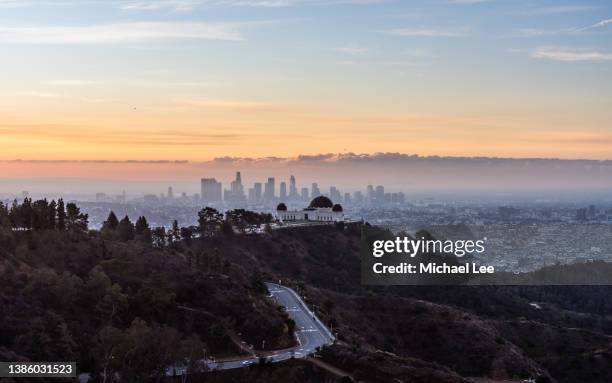 sunrise view of griffith observatory and downtown los angeles - griffith park stock pictures, royalty-free photos & images