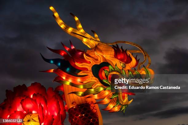 chinese traditional dragon lantern illuminated at night - chinese lantern festival stock pictures, royalty-free photos & images