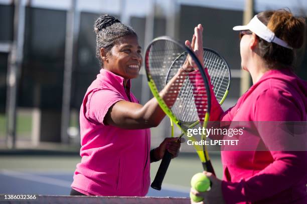 playing tennis - women tennis stock pictures, royalty-free photos & images