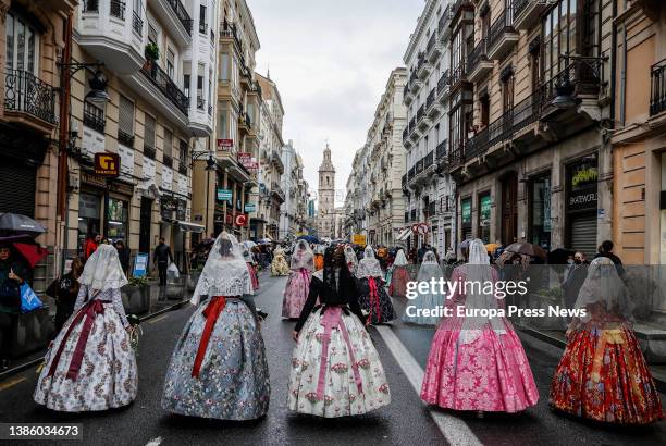 Several falleras walk during the floral offering to the Virgen de los Desamparados, on 17 March, 2022 in Valencia, Valencian Community, Spain. The...