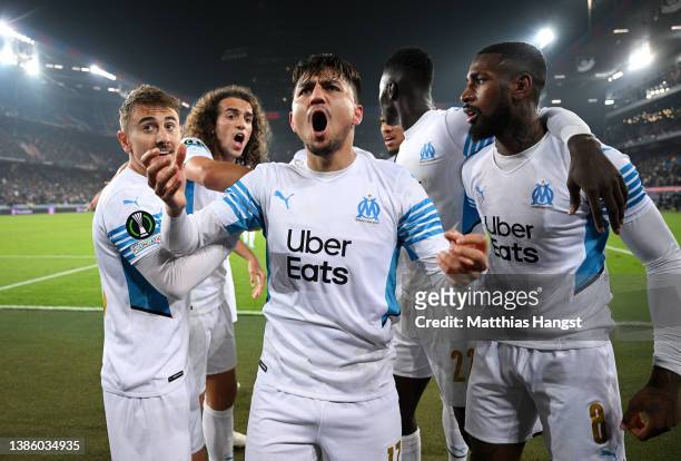 Cengiz Under celebrates with teammates Matteo Guendouzi and Gerson of Marseille after scoring their team's first goal during the UEFA Conference...