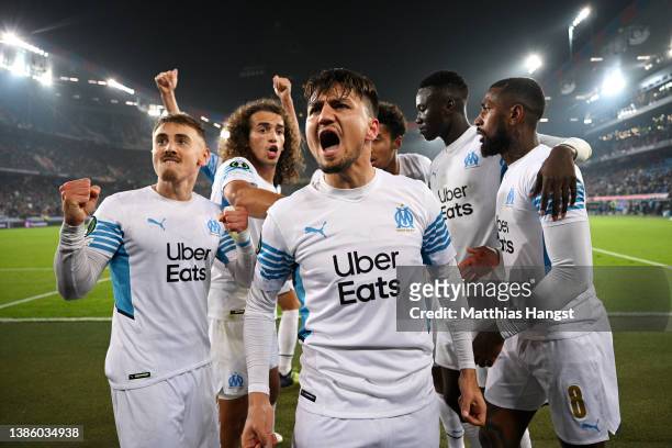Cengiz Under celebrates with teammates Matteo Guendouzi and Gerson of Marseille after scoring their team's first goal during the UEFA Conference...