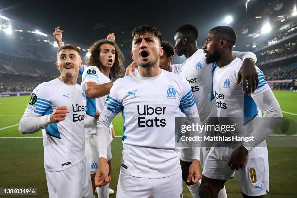 Cengiz Under celebrates with teammates Matteo Guendouzi and Gerson of Marseille after scoring their team's first goal during the UEFA Conference...