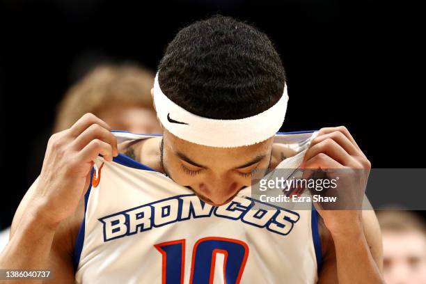 Marcus Shaver Jr. #10 of the Boise State Broncos bites his jersey as he leaves the court after the Memphis Tigers defeated the Boise State Broncos...