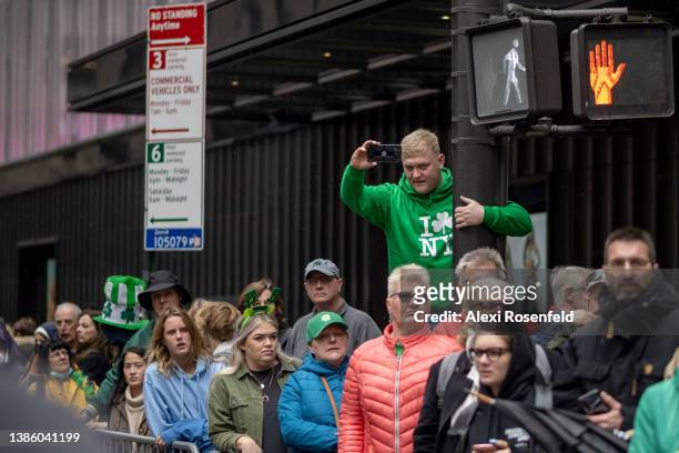 Person wearing a green I love NY shirt watches the St. Patrick’s Day parade on March 17, 2022 in New York City. The annual New York City St....