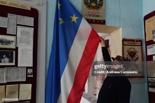 Museum employee shows the Gagauz flag, in the Comrat Regional History Museum, on March 17, 2022 in Comrat, Moldova. The autonomous region of...