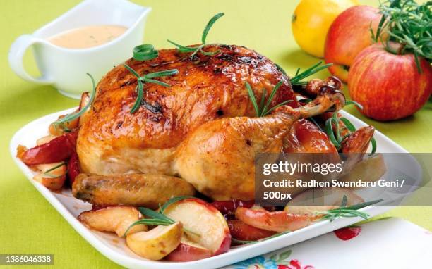 close-up of chicken meat served in plate on table,indonesia - geheel stockfoto's en -beelden