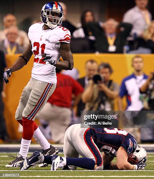 Wide receiver Wes Welker of the New England Patriots reacts after he drops a pass late in the fourth quarter as Kenny Phillips of the New York Giants...