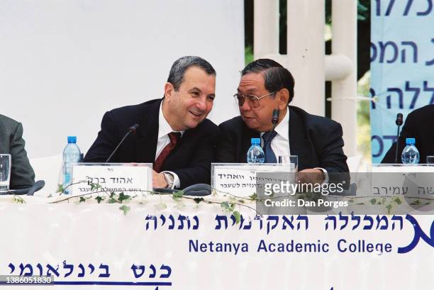 Former Israeli Prime Minister Ehud Barak and former Indonesian President Abdurrahman Wahid talk together during a conference at Natanya Academic...