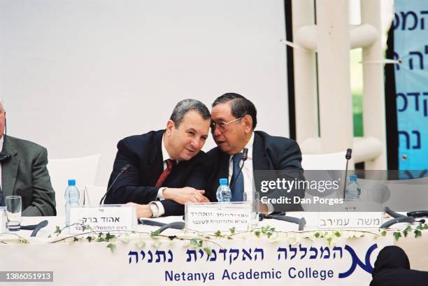 Former Israeli Prime Minister Ehud Barak and former Indonesian President Abdurrahman Wahid talk together during a conference at Natanya Academic...